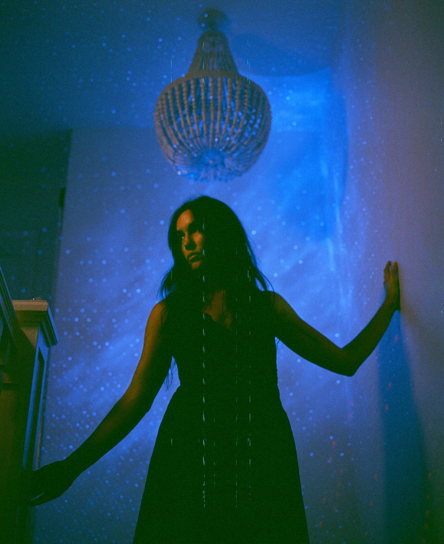 Image of woman in a blue room