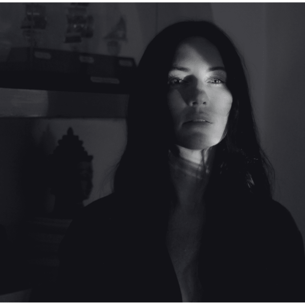 Black and white image of woman in the dark