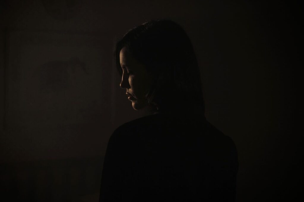 Picture of woman in a dark room