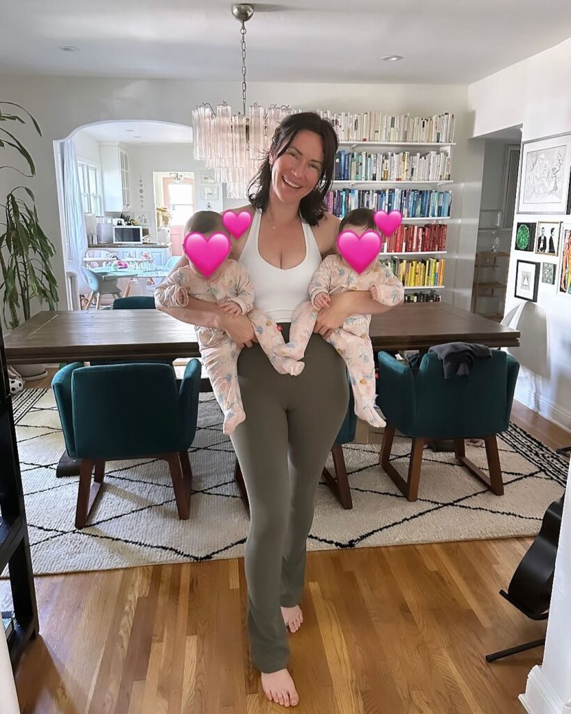 Image of woman holding two twin babies