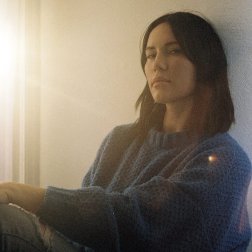 Image of woman sitting on the floor