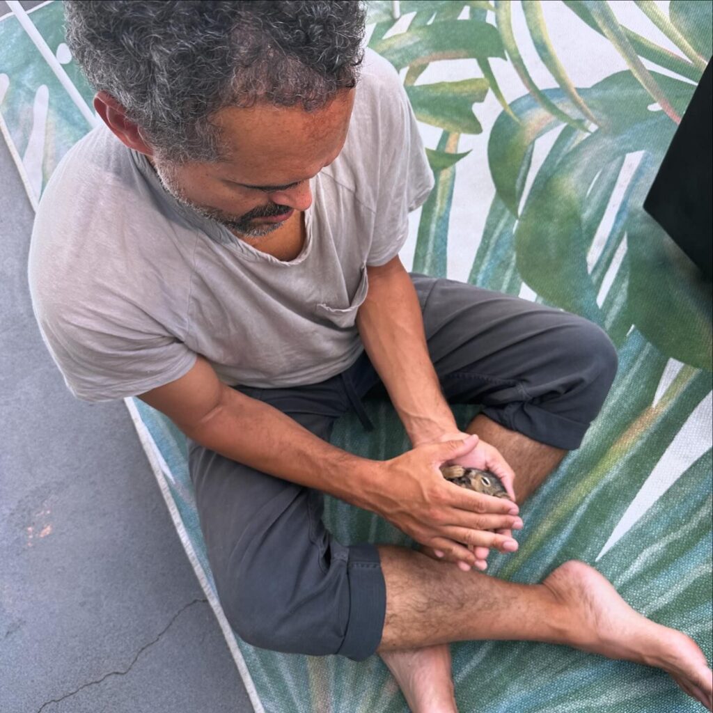 Image of a man holding a squirrel 