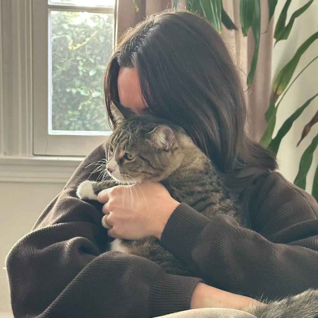 Image of woman holding her cat